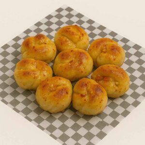 Hyper-realistic Hot Honey Garlic Knots on check deli paper, golden brown and glazed with hot honey butter, sprinkled with garlic and red pepper flakes. Perfect savory snack or lunch near me in Newport News.