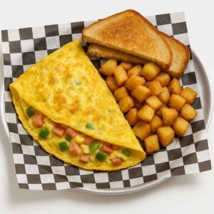 A hyper-realistic image of a Western Omelet Platter featuring a fluffy omelet filled with ham, onions, and green peppers, served with crispy home fries and toasted bread on black-and-white checkered deli paper. Perfect for anyone searching for Breakfast near me in Newport News.