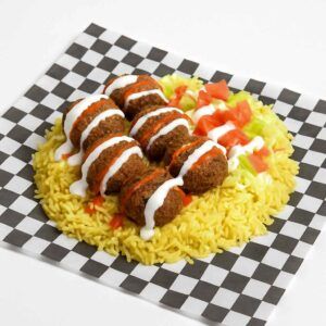 Hyper-realistic Falafel Over Rice platter on check deli paper with crispy golden falafel balls served over fluffy yellow rice, drizzled with creamy white sauce and spicy hot sauce, garnished with fresh lettuce and diced tomatoes. Perfect vegetarian Halal food or lunch near me in Newport News.