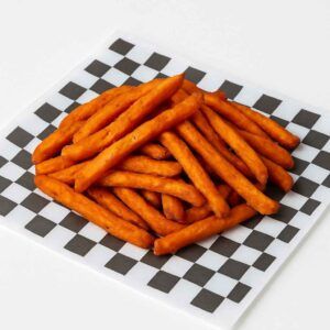 Hyper-realistic Sweet Potato Fries on check deli paper, golden orange and crispy with a light natural sweetness. Perfect side dish or snack near me in Newport News.
